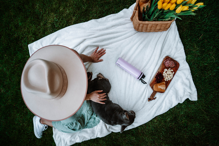 PURE drinkware speaker bottles lined up in sand