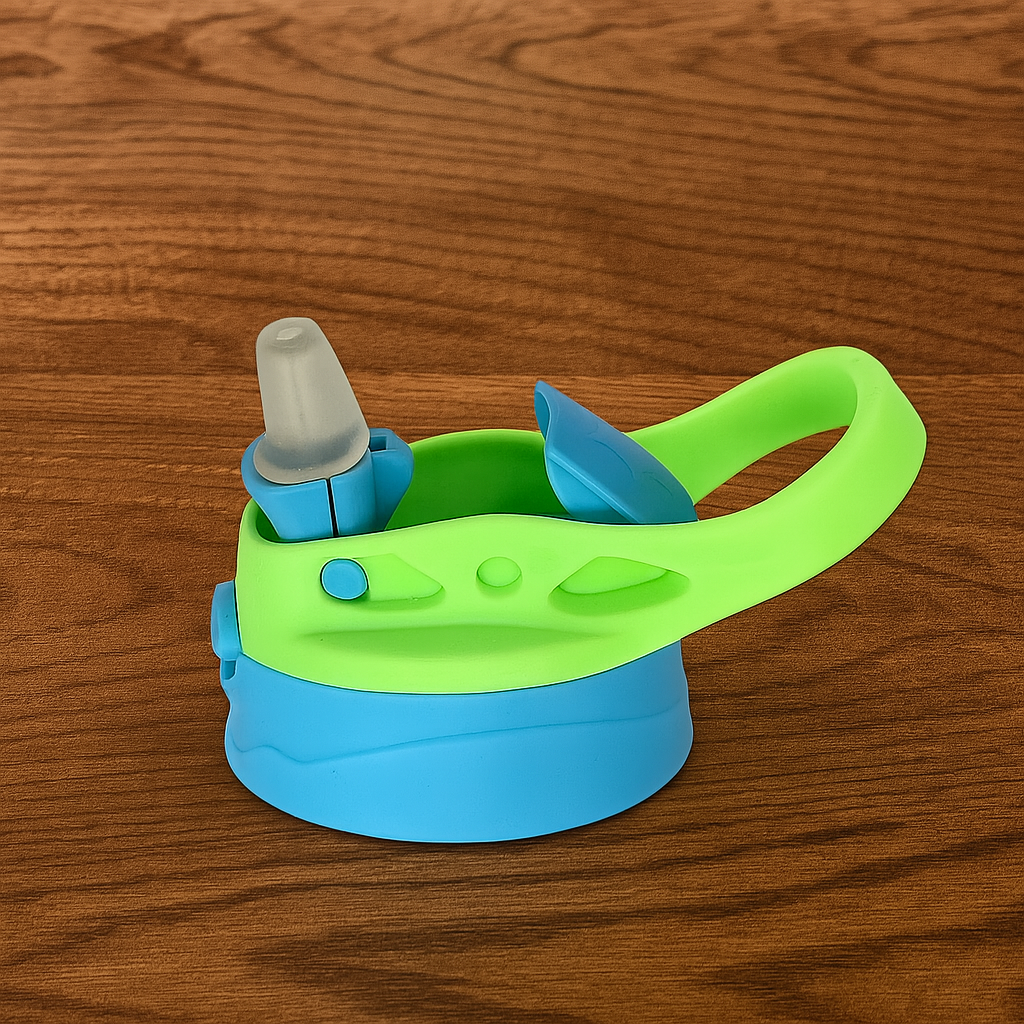 Green and blue kids flipswitch lid for sippy cups with handle on a wooden surface