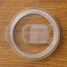 Clear plastic Push-On Slide lid for 32oz and 30oz tumblers on wood surface
