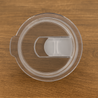 Clear Tritan spillproof twist-on slide lid plastic lid for 32oz tumblers on wood surface