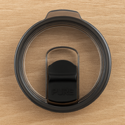 Black antimicrobial lid for 32oz tumblers with 'PURE' branding on a wooden surface