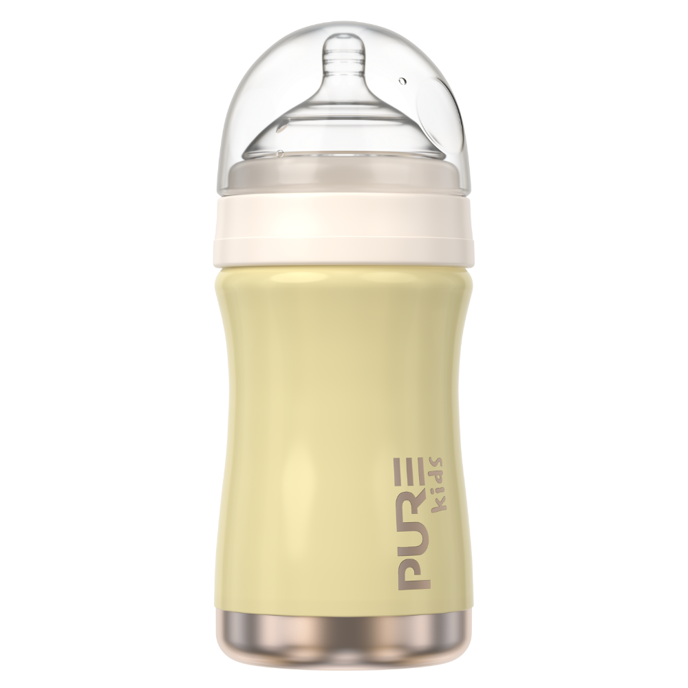 Yellow baby bottle with a clear lid on a white background